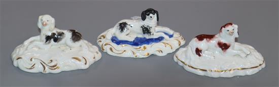 Three Staffordshire porcelain figures of King Charles Spaniels, c.1835-50, each 4cm high, 8.5cm long